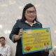 Penjaga rumah ibadah GPDI Smirna Karang Tunggal Tenggarong Seberang, Meike Walangitan.